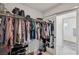 Organized walk-in closet with abundant storage and racks for clothes and accessories at 6807 Satin Silver Ct, North Las Vegas, NV 89086
