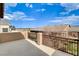 Balcony with steel railing offers neighborhood views under bright blue sky at 741 Flowing Meadow Dr, Henderson, NV 89014
