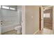 Bathroom with a toilet, bathtub, and tiled floor at 741 Flowing Meadow Dr, Henderson, NV 89014