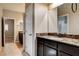 Bathroom vanity with a granite countertop and dark cabinets at 741 Flowing Meadow Dr, Henderson, NV 89014