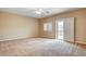 Bedroom featuring carpet floors, a ceiling fan, and access to a deck at 741 Flowing Meadow Dr, Henderson, NV 89014