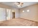 Bright bedroom with carpeted floors, ceiling fan, and lots of wall space at 741 Flowing Meadow Dr, Henderson, NV 89014