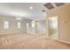 An upstairs loft area features neutral carpet, a chandelier, and bright windows at 741 Flowing Meadow Dr, Henderson, NV 89014