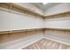 This walk-in closet is spacious, with shelves along three walls for ample storage at 741 Flowing Meadow Dr, Henderson, NV 89014