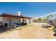 Spacious backyard featuring a covered patio, perfect for entertaining, and xeriscaping at 7701 Pheasant Ln, Las Vegas, NV 89145