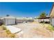 Large backyard with shed, covered patio, and xeriscaping offering space for outdoor enjoyment at 7701 Pheasant Ln, Las Vegas, NV 89145