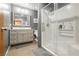 Modern bathroom featuring a glass shower, vanity, and updated fixtures at 7701 Pheasant Ln, Las Vegas, NV 89145