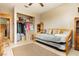 Comfortable bedroom with a daybed, closet space, and carpet flooring at 7701 Pheasant Ln, Las Vegas, NV 89145