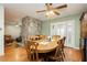 Charming dining area with a stone fireplace feature and views to the living room at 7701 Pheasant Ln, Las Vegas, NV 89145