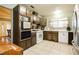 Bright kitchen with appliances and tile flooring at 7701 Pheasant Ln, Las Vegas, NV 89145