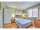 Bedroom with hardwood floors, neutral walls, and lots of natural light at 7961 Lions Rock Way # 202, Las Vegas, NV 89128