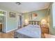 Bedroom with hardwood floors, neutral walls, and ensuite bath at 7961 Lions Rock Way # 202, Las Vegas, NV 89128