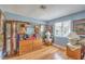 Bedroom with hardwood floors, blue walls, and lots of art at 7961 Lions Rock Way # 202, Las Vegas, NV 89128