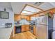 Efficient kitchen with stainless steel appliances and wood cabinets at 7961 Lions Rock Way # 202, Las Vegas, NV 89128