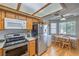 Bright eat-in kitchen featuring stainless steel appliances, and wood cabinets at 7961 Lions Rock Way # 202, Las Vegas, NV 89128