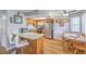 Bright eat-in kitchen features stainless steel appliances, a breakfast bar, and plenty of natural light at 7961 Lions Rock Way # 202, Las Vegas, NV 89128
