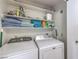 Laundry area featuring washer, dryer, and shelving for storage at 7961 Lions Rock Way # 202, Las Vegas, NV 89128