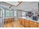 Cozy living room and eat-in kitchen featuring hardwood floors and lots of natural light at 7961 Lions Rock Way # 202, Las Vegas, NV 89128