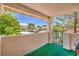 Patio area featuring stucco walls, a grill, and a view of the neighborhood at 7961 Lions Rock Way # 202, Las Vegas, NV 89128
