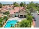 Aerial view showcasing a private backyard pool with mature landscaping and outdoor seating at 7988 Pinnacle Peak Ave, Las Vegas, NV 89113