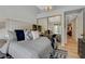 Comfortable bedroom featuring a large mirror closet, plush bedding, and stylish decor at 7988 Pinnacle Peak Ave, Las Vegas, NV 89113
