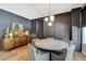 Elegant dining room with stylish lighting, gray walls, and seating for six at 7988 Pinnacle Peak Ave, Las Vegas, NV 89113
