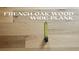 Close up of new french oak wood wide plank floors; tape measure shows plank width at 7988 Pinnacle Peak Ave, Las Vegas, NV 89113
