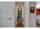 Tastefully decorated hallway with artwork and a glimpse into a cozy bedroom at 7988 Pinnacle Peak Ave, Las Vegas, NV 89113