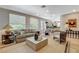 Comfortable living room with views to the kitchen and dining areas at 7988 Pinnacle Peak Ave, Las Vegas, NV 89113