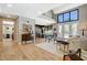 Bright open living area featuring high ceilings, wood floors, and modern furnishings at 7988 Pinnacle Peak Ave, Las Vegas, NV 89113