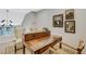 Elegant home office featuring a beautiful wooden desk, chairs, and natural lighting at 7988 Pinnacle Peak Ave, Las Vegas, NV 89113