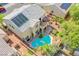 Aerial view of a two-story home, solar panels, backyard pool, patio furniture, and landscaped backyard at 8029 Flambeau St, Las Vegas, NV 89131