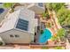 Aerial view of a home featuring a pool, upper deck with lounge furniture, and well-maintained landscaping at 8029 Flambeau St, Las Vegas, NV 89131