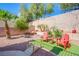 Charming backyard featuring decorative bridge, Adirondack chairs, and desert landscaping at 8029 Flambeau St, Las Vegas, NV 89131