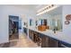 Spacious bathroom with dual sinks, ample counter space, and a walk-in closet at 8029 Flambeau St, Las Vegas, NV 89131