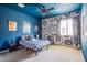 Unique bedroom with blue walls, black and white accent wall, and a fun, contemporary design at 8029 Flambeau St, Las Vegas, NV 89131