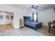 Inviting bedroom with comfortable bed, ceiling fan, and modern décor elements at 8029 Flambeau St, Las Vegas, NV 89131