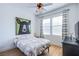 Bright bedroom with natural light, wood floors, ceiling fan, and a quirky bear portrait at 8029 Flambeau St, Las Vegas, NV 89131