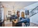 Open concept dining area with modern decor, hardwood floors, and staircase to the upper level at 8029 Flambeau St, Las Vegas, NV 89131