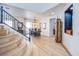 Open-concept living space with dining area featuring modern lighting and hardwood floors, connecting the living areas at 8029 Flambeau St, Las Vegas, NV 89131