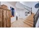 Elegant foyer with hardwood floors, staircase with iron railings, and stylish decor at 8029 Flambeau St, Las Vegas, NV 89131