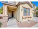 Inviting front entrance with stone accents, covered porch, and stylish exterior lighting at 8029 Flambeau St, Las Vegas, NV 89131
