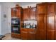 Close up of kitchen cabinets, granite counters, and built in oven at 8029 Flambeau St, Las Vegas, NV 89131