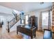 Well-lit home office space with hardwood floors, custom cabinetry, and a staircase to the upper level at 8029 Flambeau St, Las Vegas, NV 89131