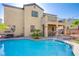 Relaxing backyard pool with lounge chairs, patio and upstairs balcony at 8029 Flambeau St, Las Vegas, NV 89131