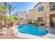 Backyard pool with mature palm trees and patio space for outdoor seating at 8029 Flambeau St, Las Vegas, NV 89131