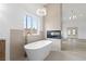 Bright bathroom featuring a standalone tub, modern lighting, and sleek finishes at 8032 Deep Stone Ave, Las Vegas, NV 89149