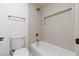 Clean bathroom featuring a bathtub and shower with decorative tile and modern fixtures at 8032 Deep Stone Ave, Las Vegas, NV 89149