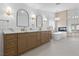 Stunning primary bathroom featuring dual sinks, bathtub, and fireplace for a spa-like experience at 8032 Deep Stone Ave, Las Vegas, NV 89149