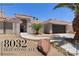 Charming single-story home featuring desert landscaping, a two-car garage, and a welcoming entrance at 8032 Deep Stone Ave, Las Vegas, NV 89149
